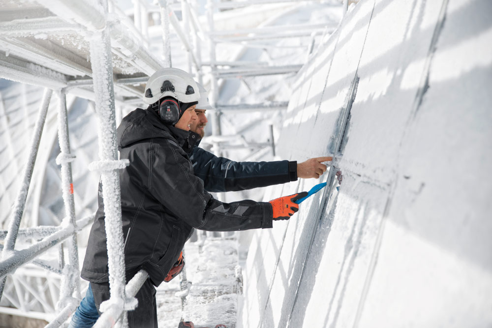 Just like in town: scraping off the ice before you start work